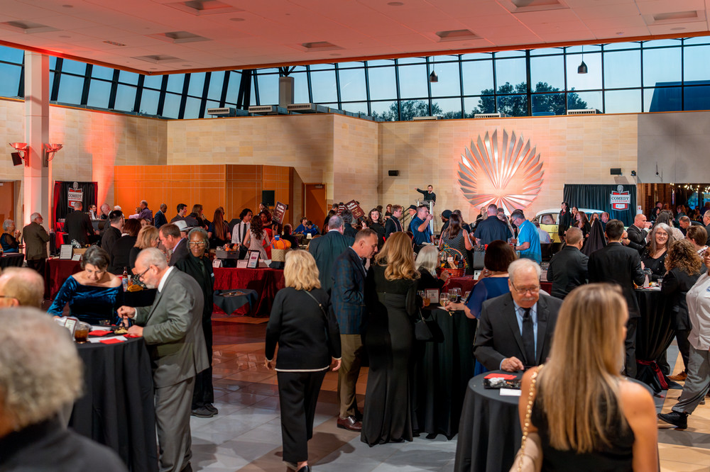 Guests enjoy a strolling gourmet dinner and a cocktail reception at the Macomb Community College Foundation’s annual Comedy and Cocktails event held help to support the college’s arts and culture programming.